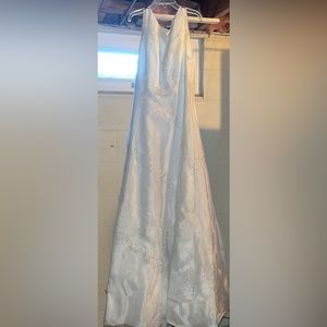 Michaelangelo size 2 wedding dress. Bought in prom section, comes with veil.